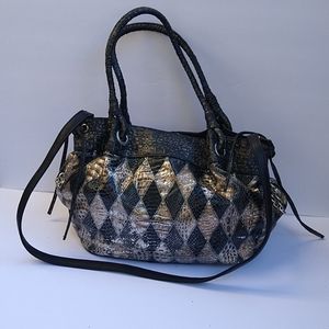 A black and silver shoulder purse.